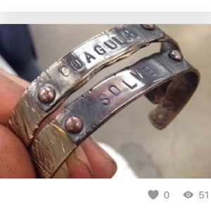 Solve/Coagula matching silver/brass bracelets.